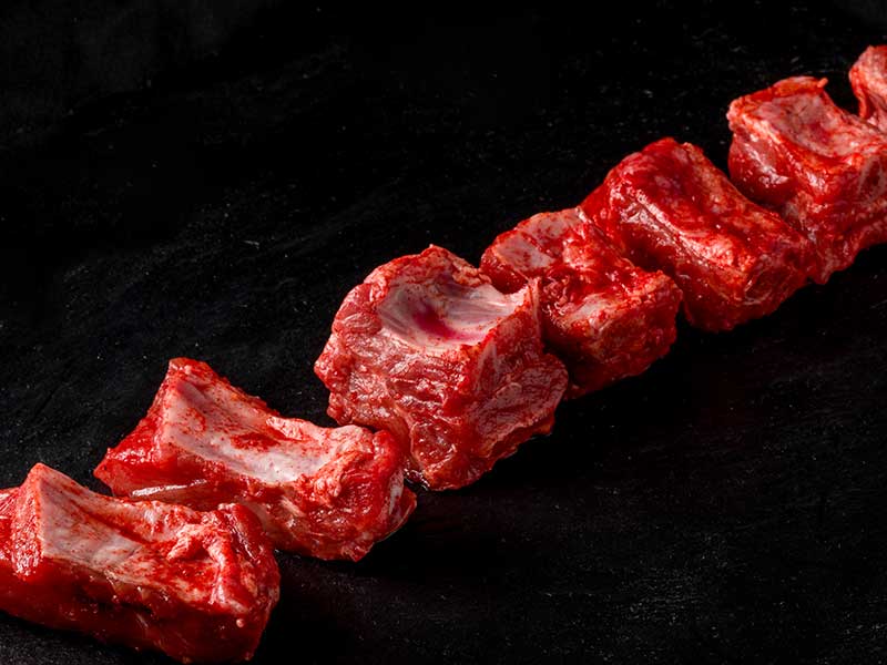 Costilla de cerdo adobada troceada